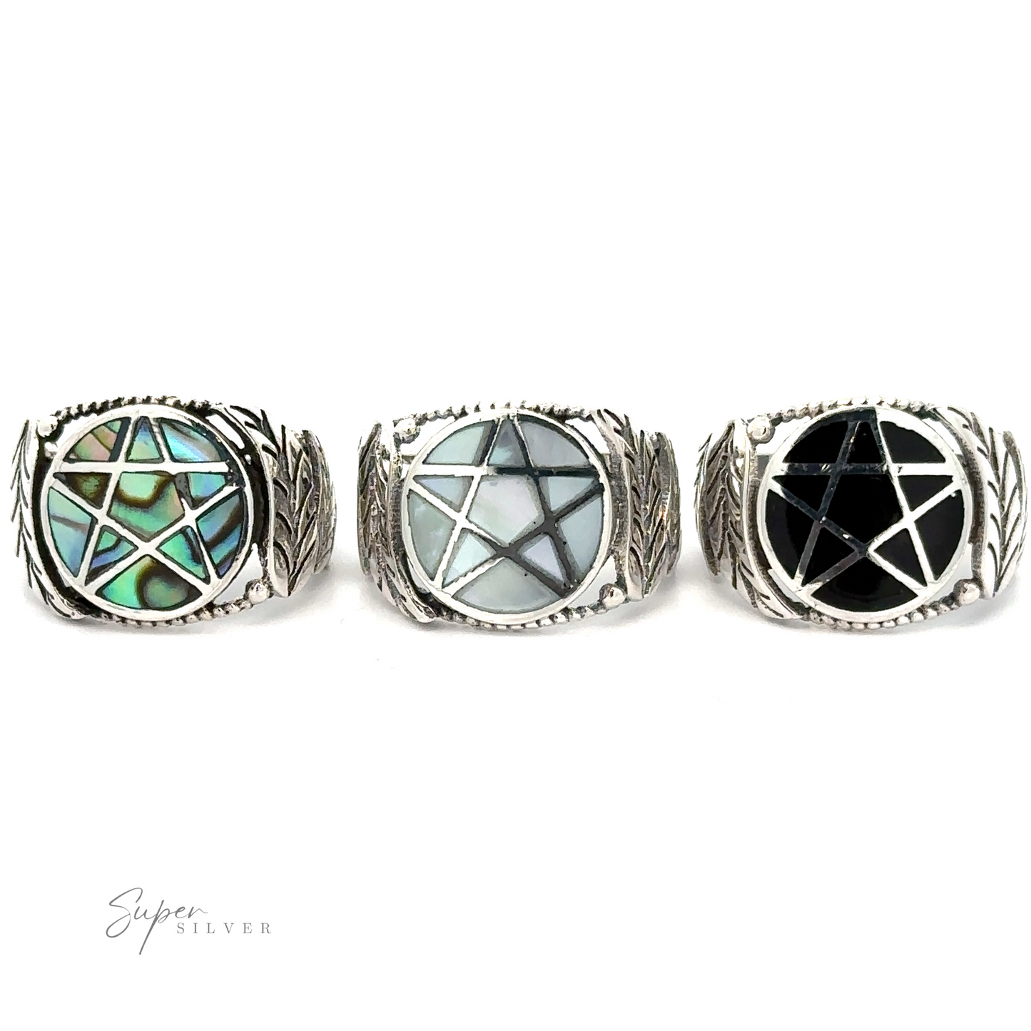 Three sterling silver rings with geometric gemstone inlays on a white background, including a Pentagram Ring with Inlaid Stones.