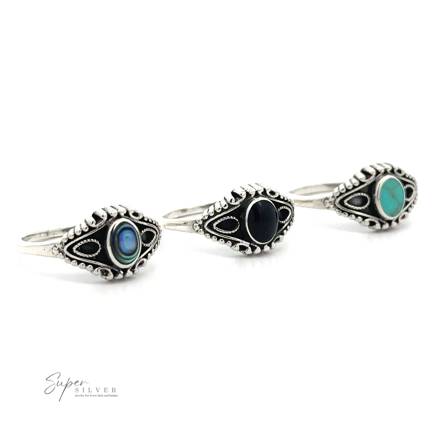 Three silver rings with gemstone inlays (blue, black, and turquoise) are lined up in a row on a white background. The Vintage Style Ring With Inlaid Oval Stone showcases a vintage-style oval ring design. The logo "Super Silver" is in the lower left corner.