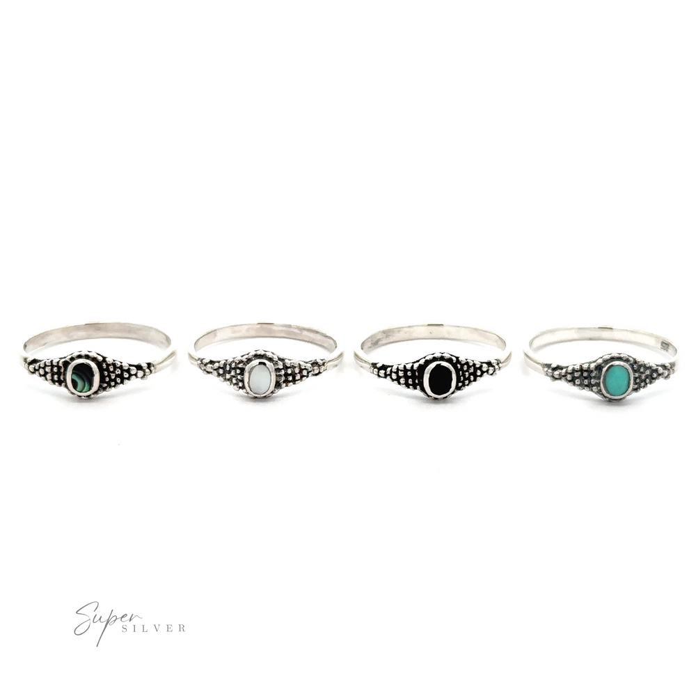 
                  
                    A set of four Dainty Inlaid Rings with Beaded Texture.
                  
                