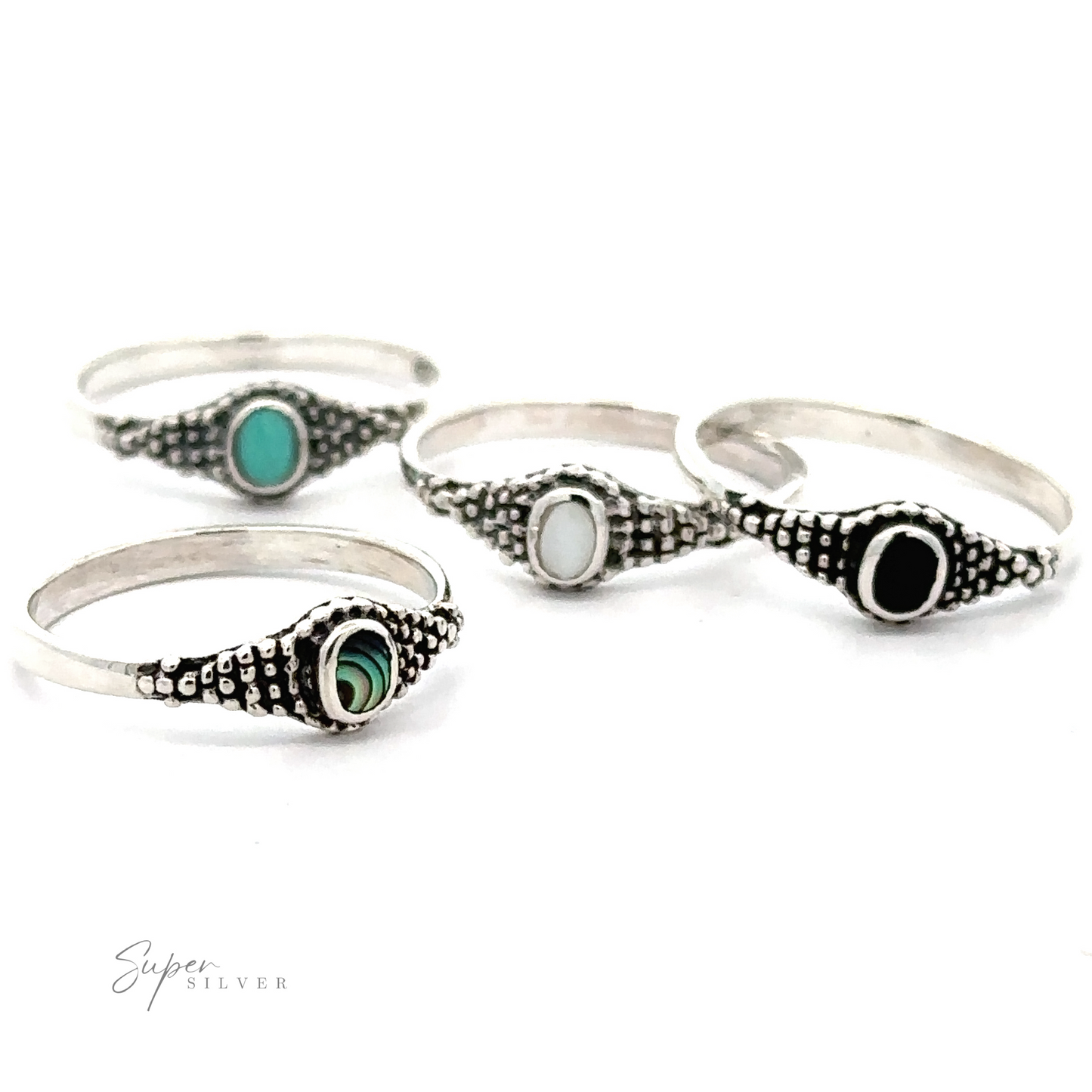 Four Dainty Inlaid Rings with Beaded Texture, including abalone and Bali-style beading.