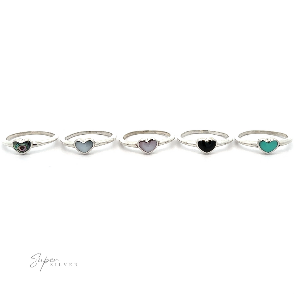 
                  
                    A row of rings with a Stone Wire Heart Ring.
                  
                