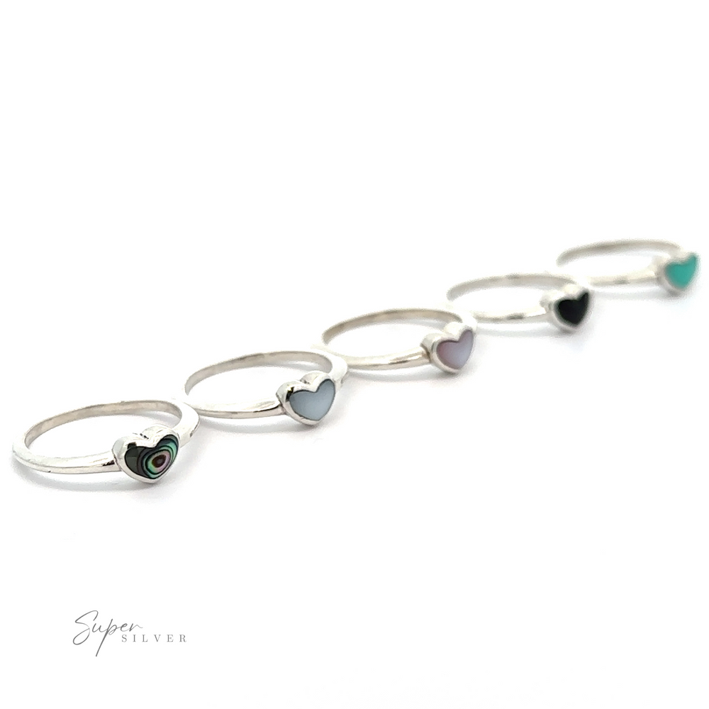 A row of Stone Wire Heart Rings with inlaid stones.