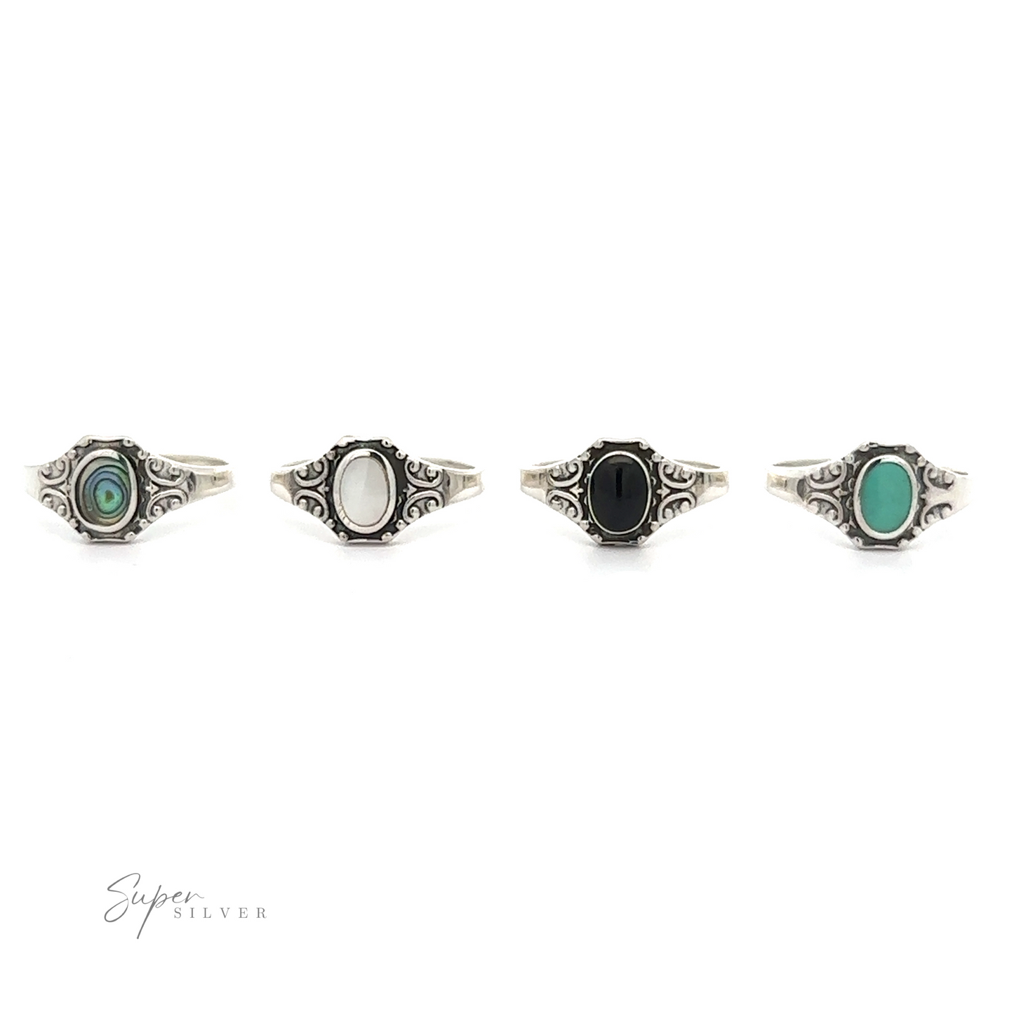 
                  
                    Four Oval Inlay Stone Rings with Antiqued Filigree Design in black, green, and white.
                  
                