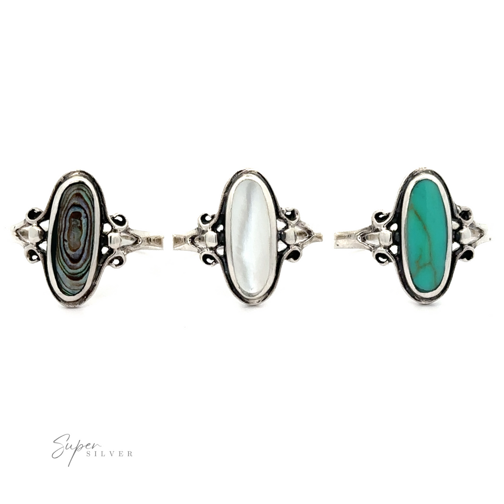 
                  
                    Three Oval Stone Rings with Delicate Border; one has a turquoise stone, the middle a Mother of Pearl stone, and the third a multicolored stone.
                  
                