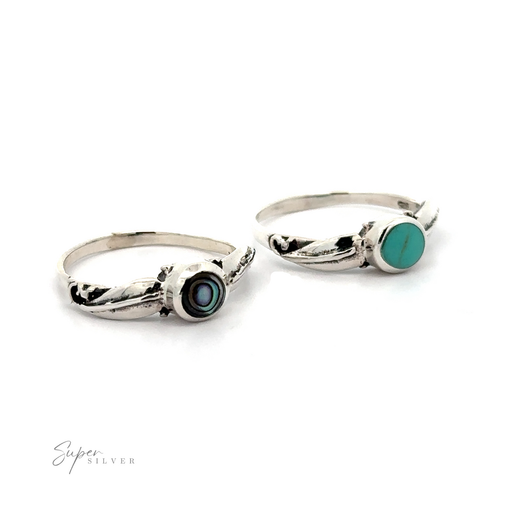Two Round Stone Rings With Leaves.