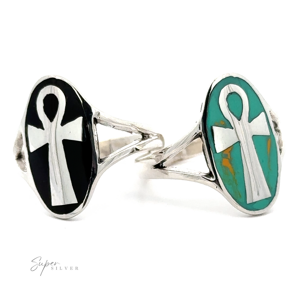 An Ankh ring with a cross and turquoise stones, made of sterling silver.