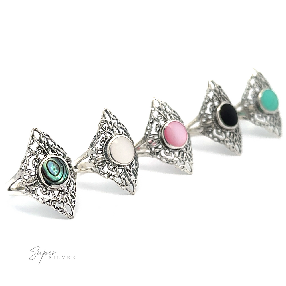 A row of Diamond Shaped Filigree Rings with Round Inlaid Stones in different colors.