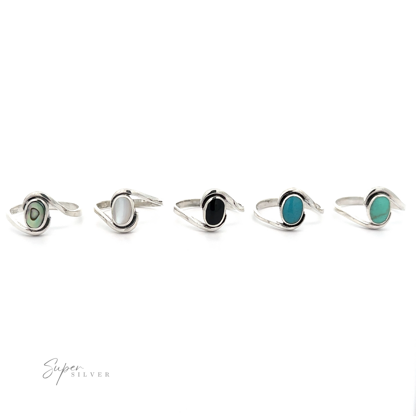 
                  
                    A row of Simple Freeform Rings with Oval Inlaid Stones made of sterling silver and featuring turquoise and black stones.
                  
                