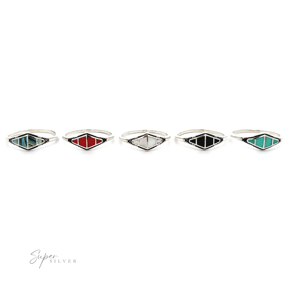 
                  
                    A unique set of five Diamond Shape Sectioned Stone Rings with red, blue, green, and yellow stones.
                  
                