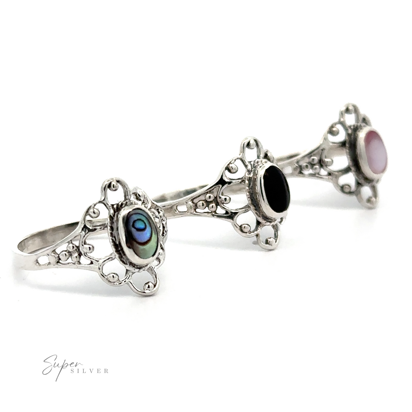 
                  
                    Three silver rings with Vintage-Styled Flower Ring with Inlaid Stones and lacey petals.
                  
                