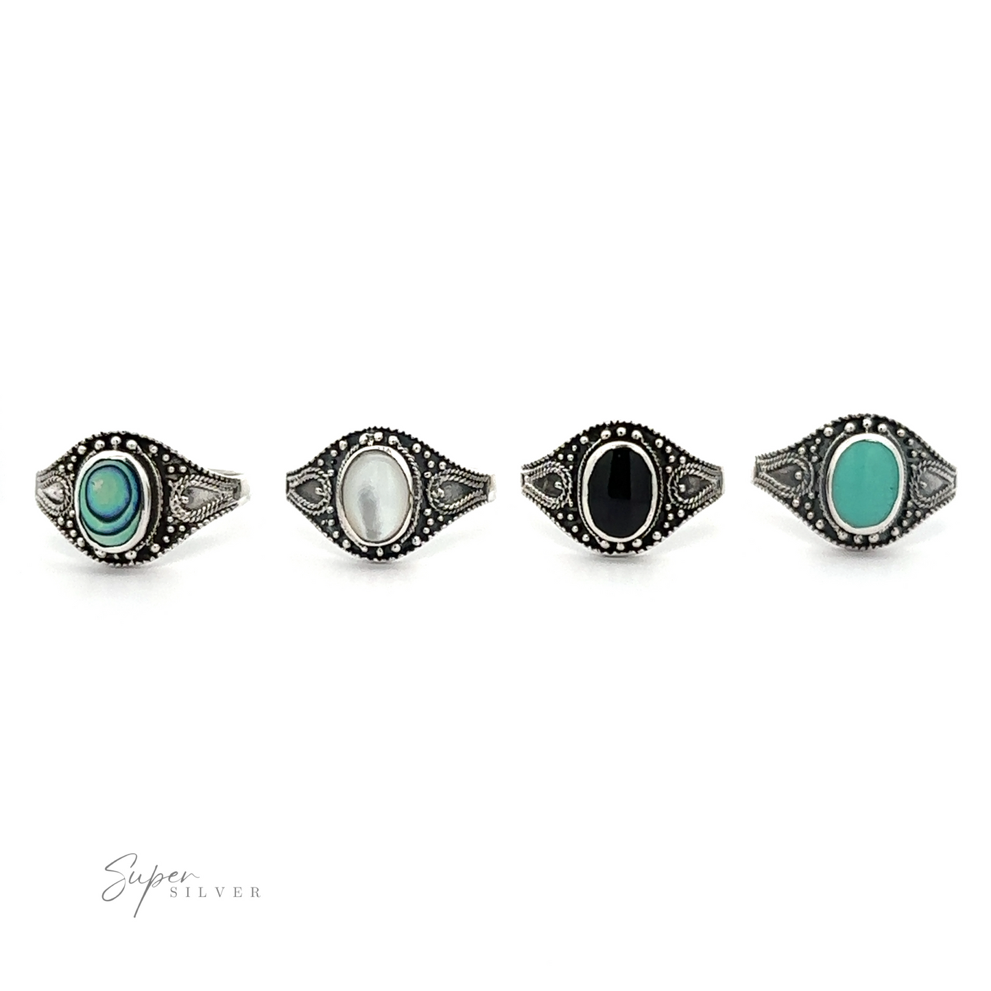 
                  
                    A Vintage Style Oval Shield Ring with Inlaid Stones set featuring oxidized detailing and wide bands.
                  
                