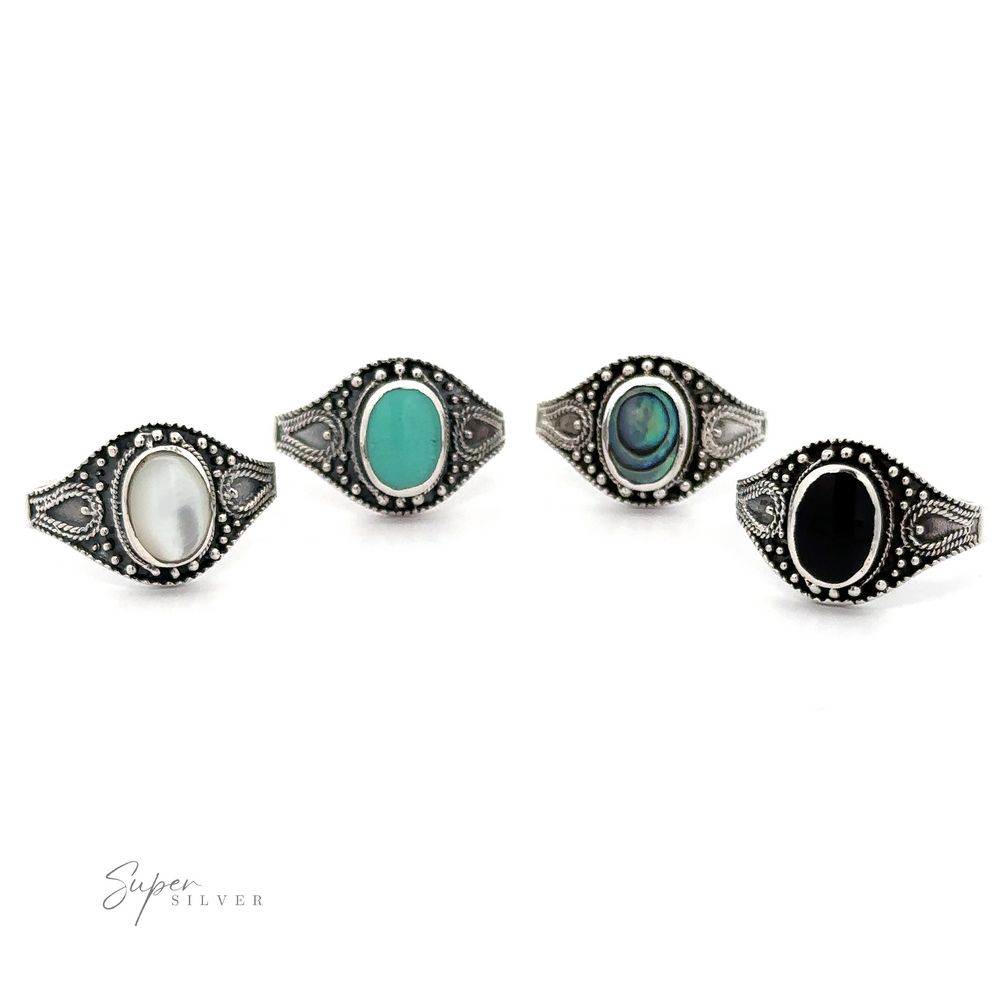 A set of four Vintage Style Oval Shield Rings with Inlaid Stones, featuring oxidized detailing for a bohemian charm.