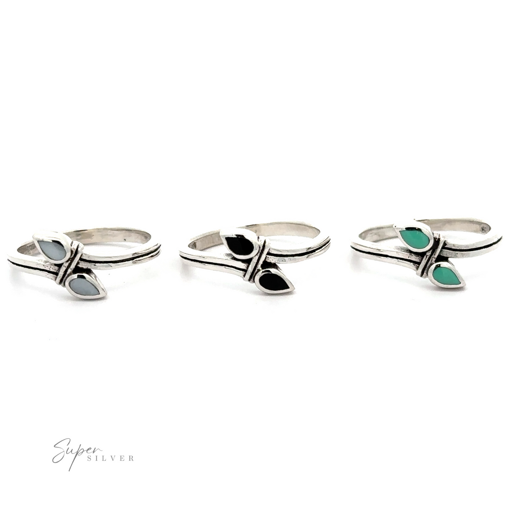 Three Inlay Teardrop Rings with turquoise and black stones.