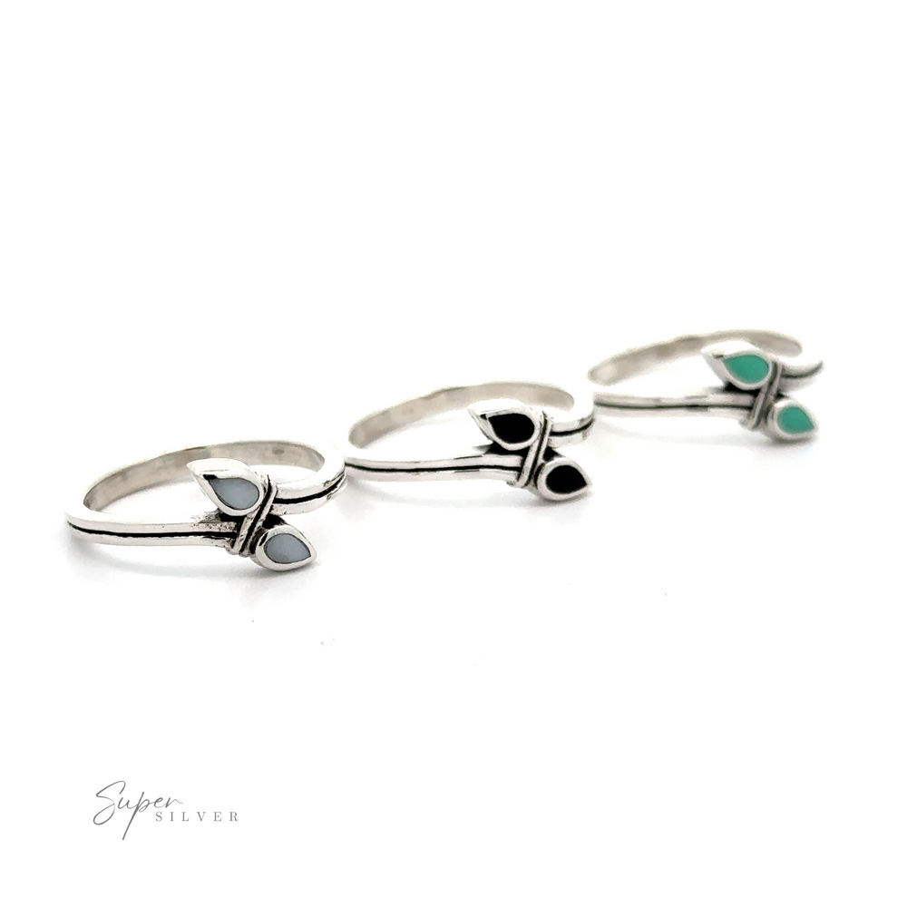 
                  
                    Three Inlay Teardrop Rings with inlaid turquoise stones.
                  
                