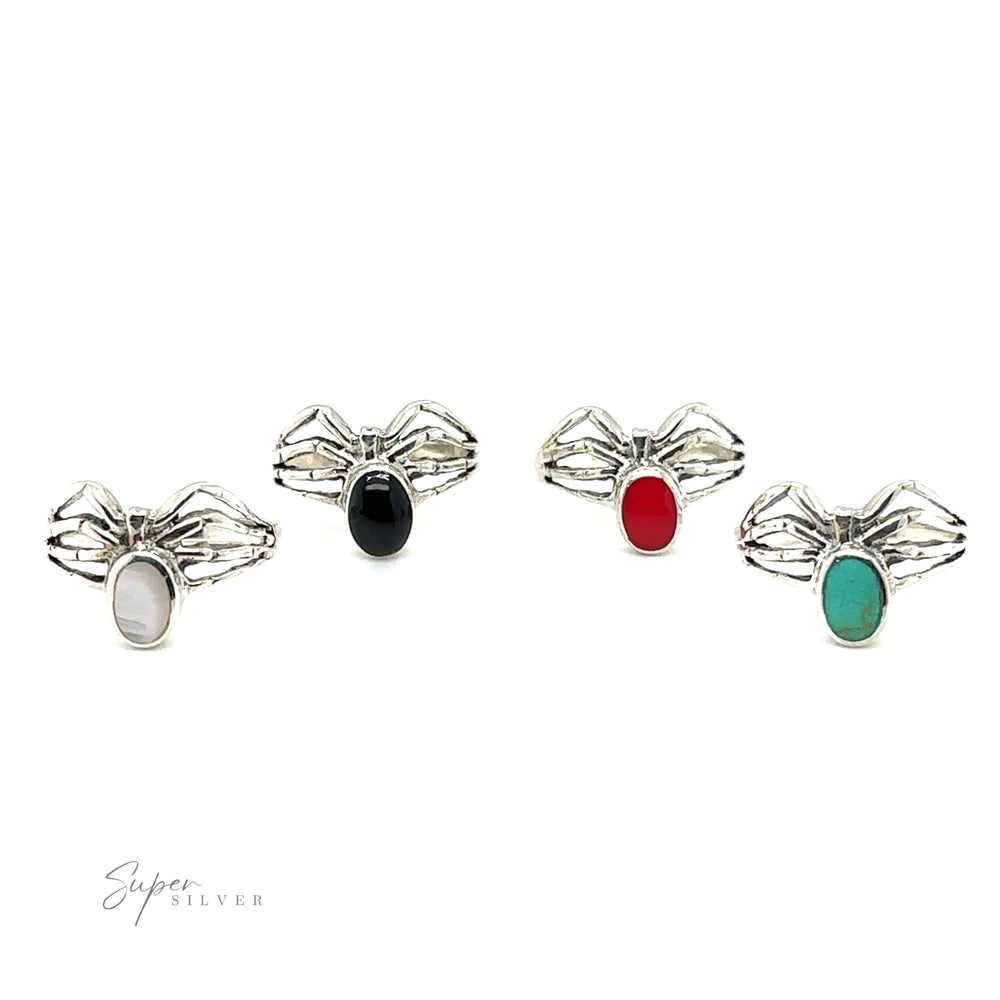 A mystical Super Silver Inlay Stone Spider Ring adorned with a red, green, and blue enchantress stone.