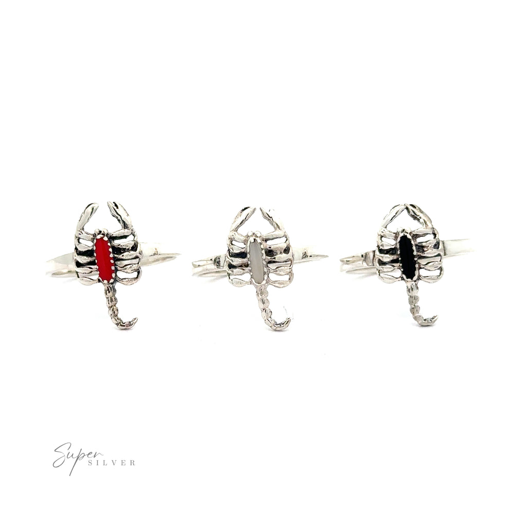 
                  
                    Three Small Scorpion Rings with Inlaid Stone in .925 Sterling Silver on a white background.
                  
                