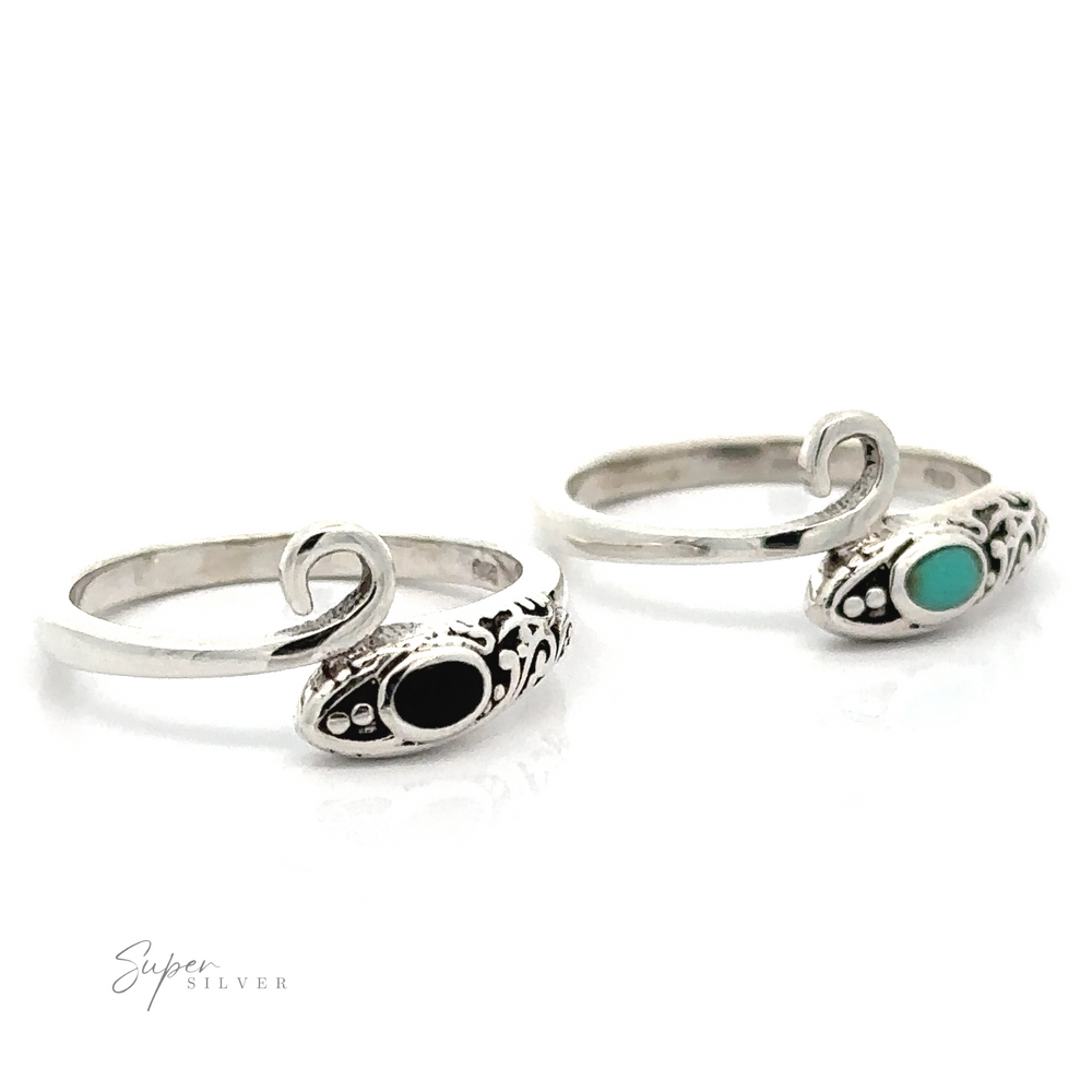 Two Inlay Stone Snake Rings with filigree designs.