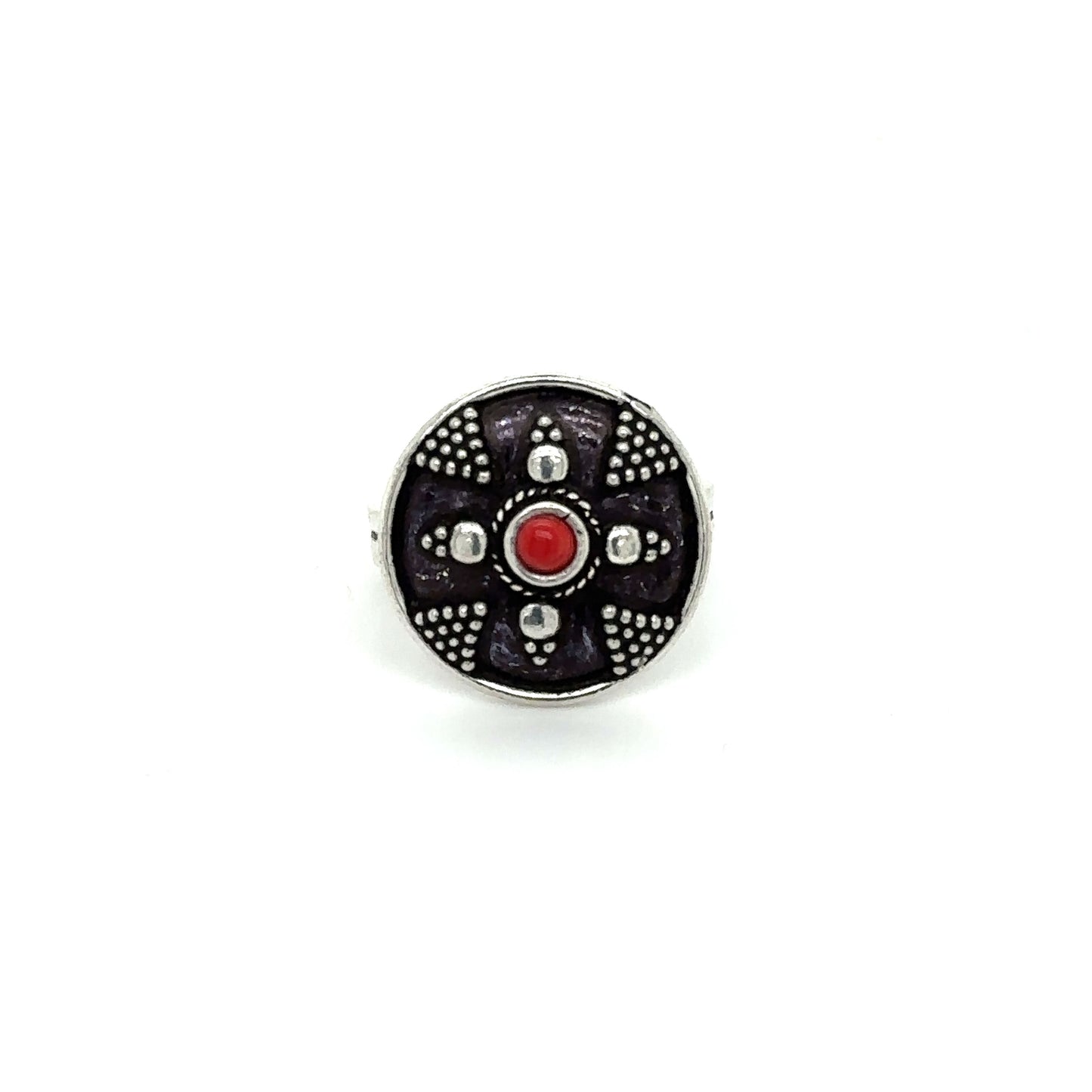 
                  
                    A Stunning Tibetan-Style Ring with a red stone in the center.
                  
                