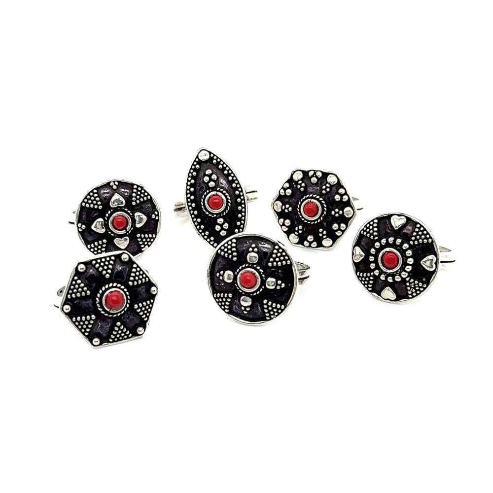 
                  
                    A stunning Tibetan-Style ring adorned with red and black stones, creating a bohemian masterpiece called the Tibetan-Style Rings with Small Stones.
                  
                