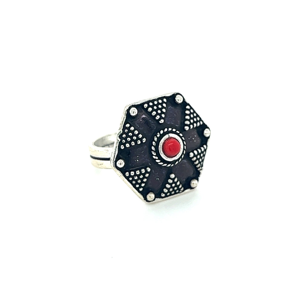 
                  
                    A Stunning Tibetan-Style Ring with Small Stones featuring an octagonal shape and a red stone.
                  
                