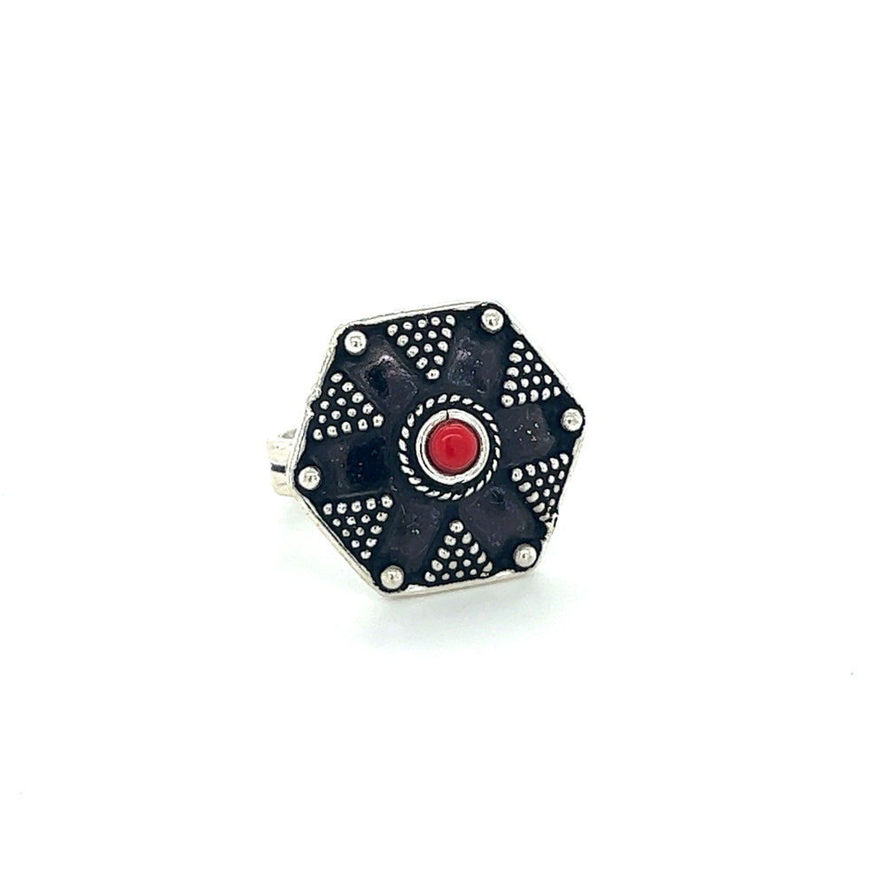 
                  
                    A stunning Tibetan-Style Ring with Small Stones featuring a black and red band adorned with a vibrant red stone.
                  
                