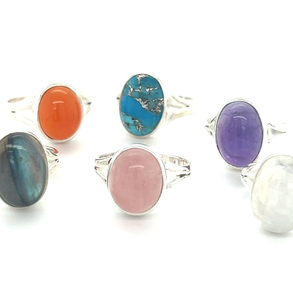 A stunning collection of oval stone rings adorned with vibrant cabochon stones.