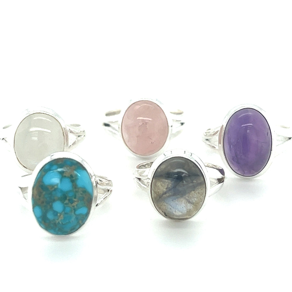A boho-inspired collection of Oval Stone Rings featuring cabochon gemstones.