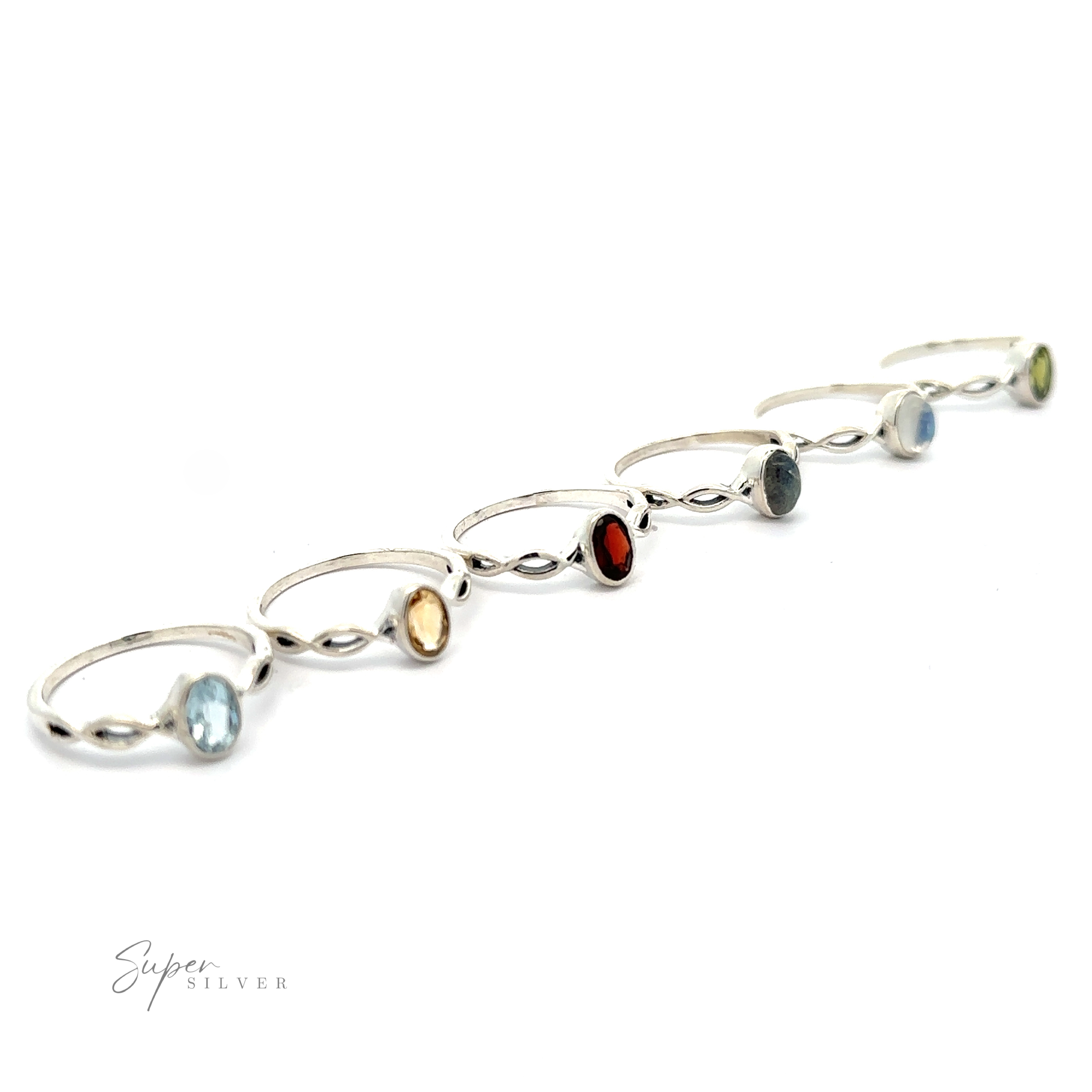 Dainty Oval Gemstone Ring with Twisted Band displayed against a white background.