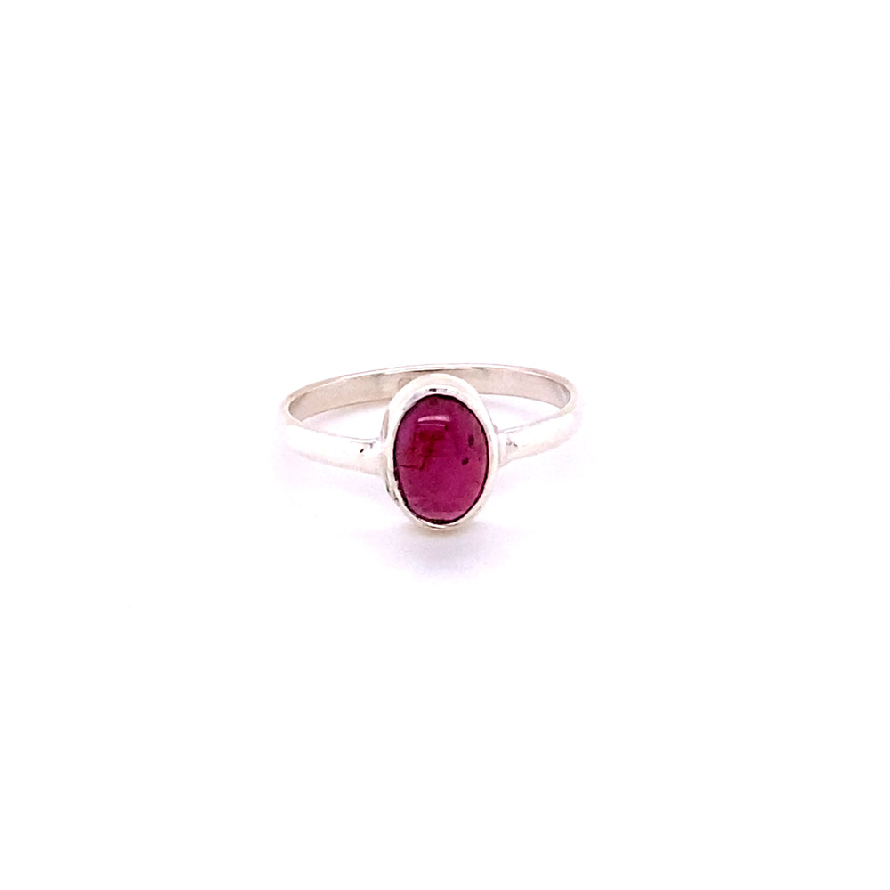 
                  
                    Simple Oval Natural Gemstone Ring with an oval-shaped, deep pink gemstone, centered on a plain band, isolated on a white background.
                  
                