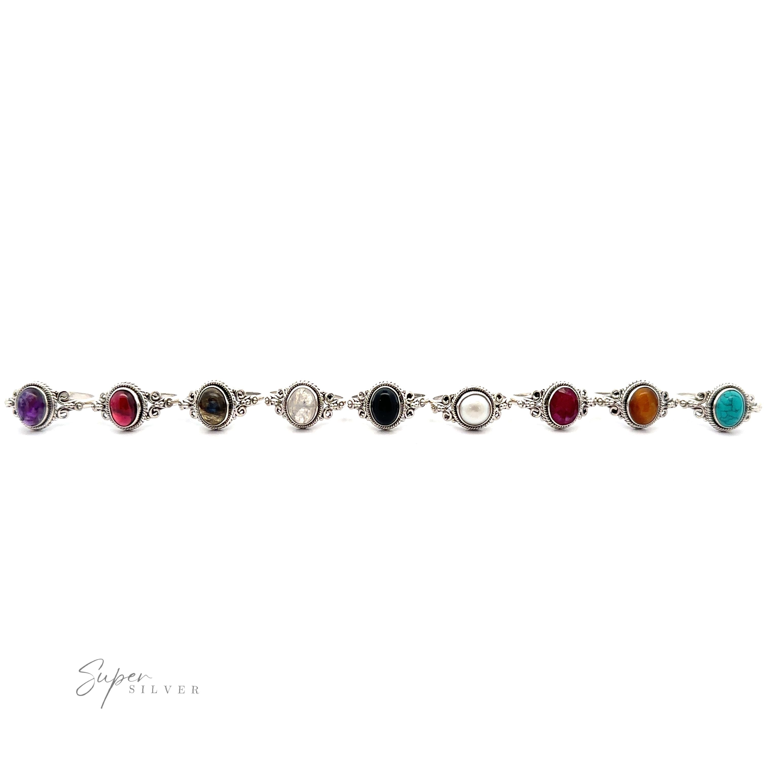 A silver bracelet with Natural Oval Gemstone Ring with Intricate Rope and Long Spiral Border accents and vintage appeal.