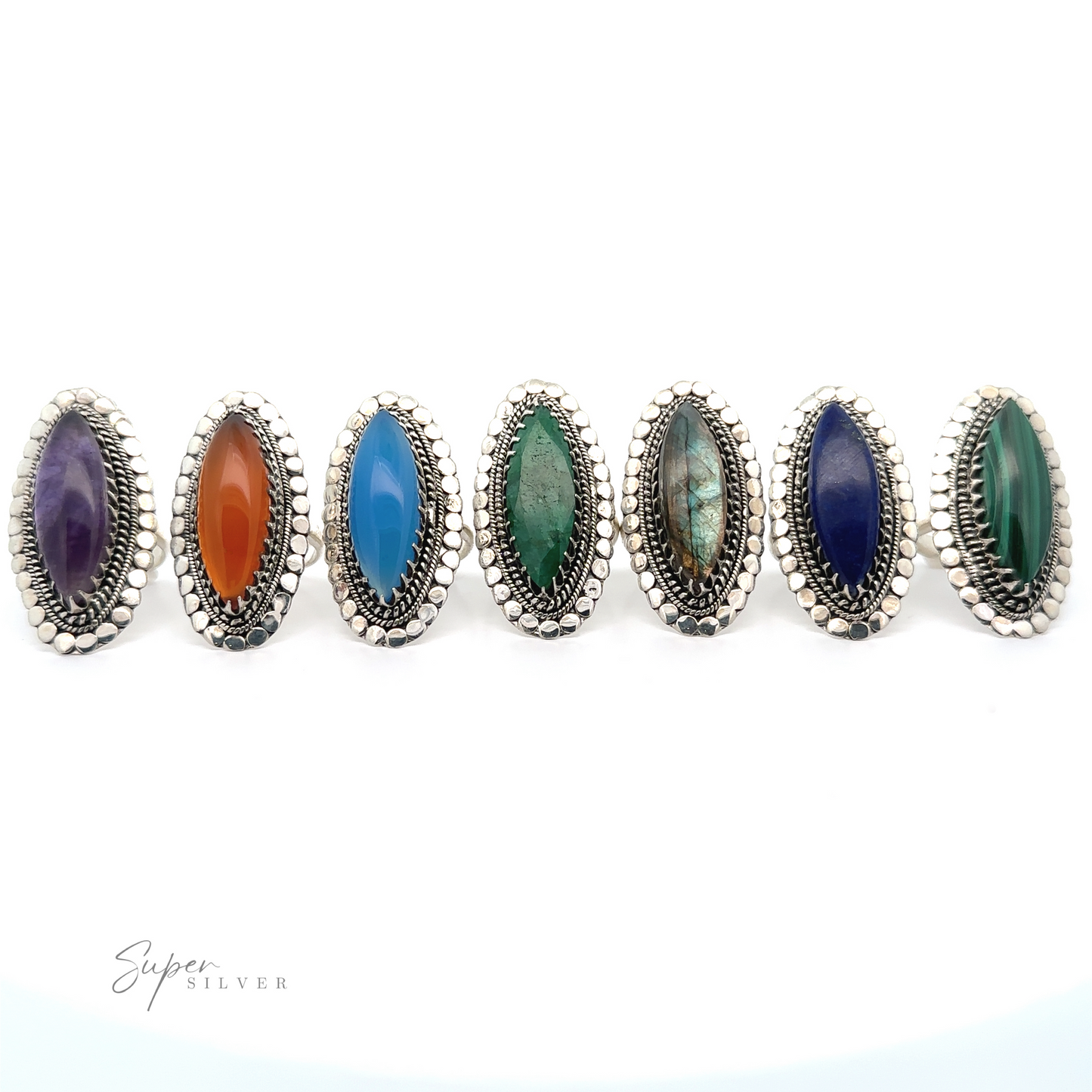Six silver rings with large gemstones in vibrant shades of purple, orange, blue, turquoise, dark blue, and green are displayed in a row on a white background. Perfect as Statement Marquise Shaped Gemstone Ring pieces, these unique rings are highlighted by "Super Silver" text in the corner.