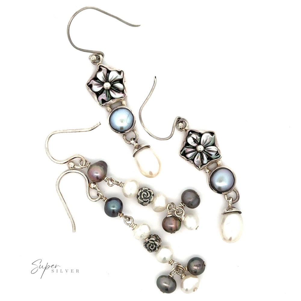 
                  
                    Two sets of Floral Pearl Bead Earrings featuring floral designs and various beads, including pearls and metallic elements, displayed on a white background.
                  
                