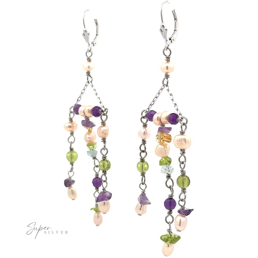 
                  
                    A pair of Dangly Multicolor Bead Earrings featuring assorted multicolor beads in shades of pink, purple, green, and light blue, attached to a sterling silver chain with leverback clasps.
                  
                
