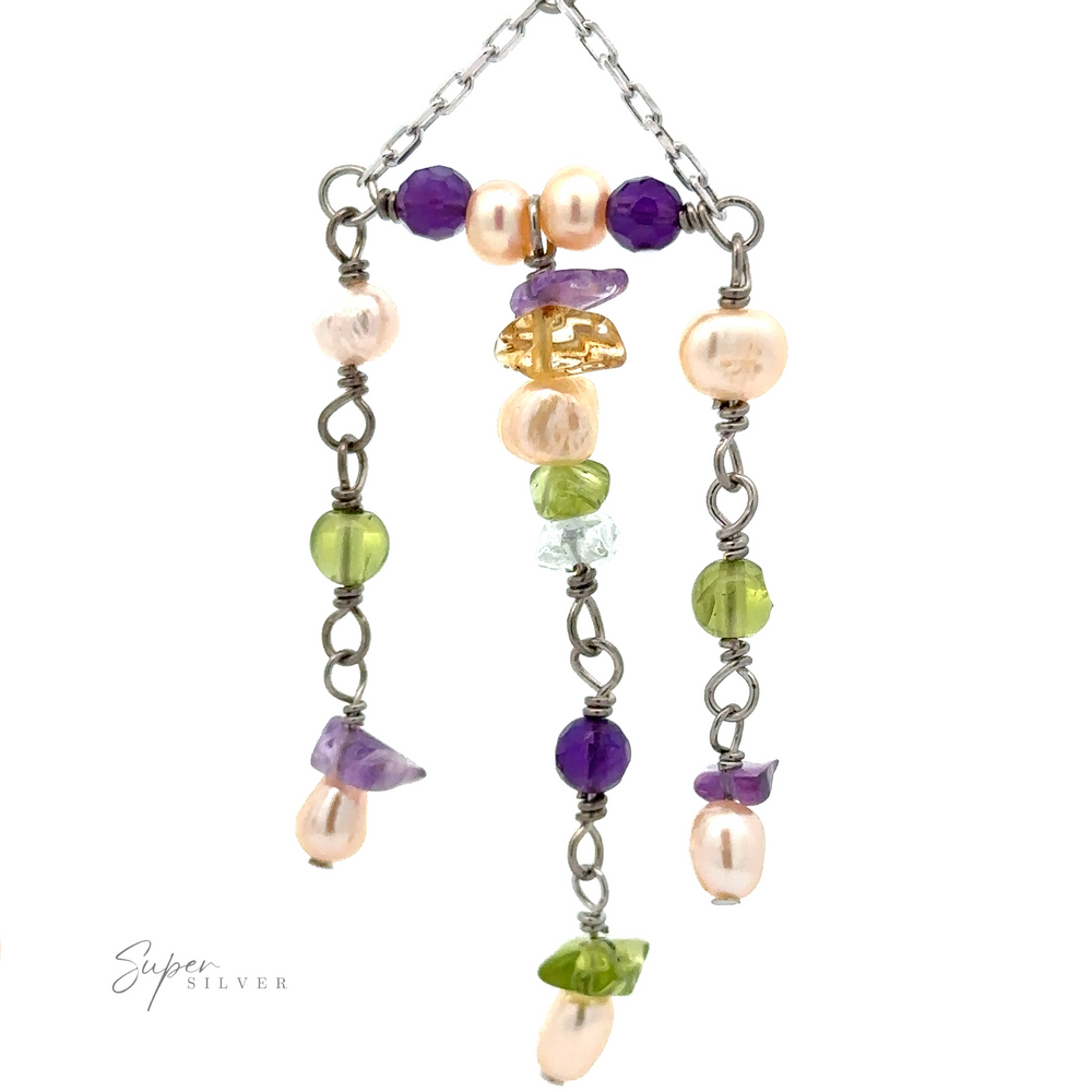 
                  
                    A pair of Dangly Multicolor Bead Earrings made of sterling silver chains and multicolor beads, including purple, green, and pink variants. The beads are attached in a branching, whimsical pattern.
                  
                