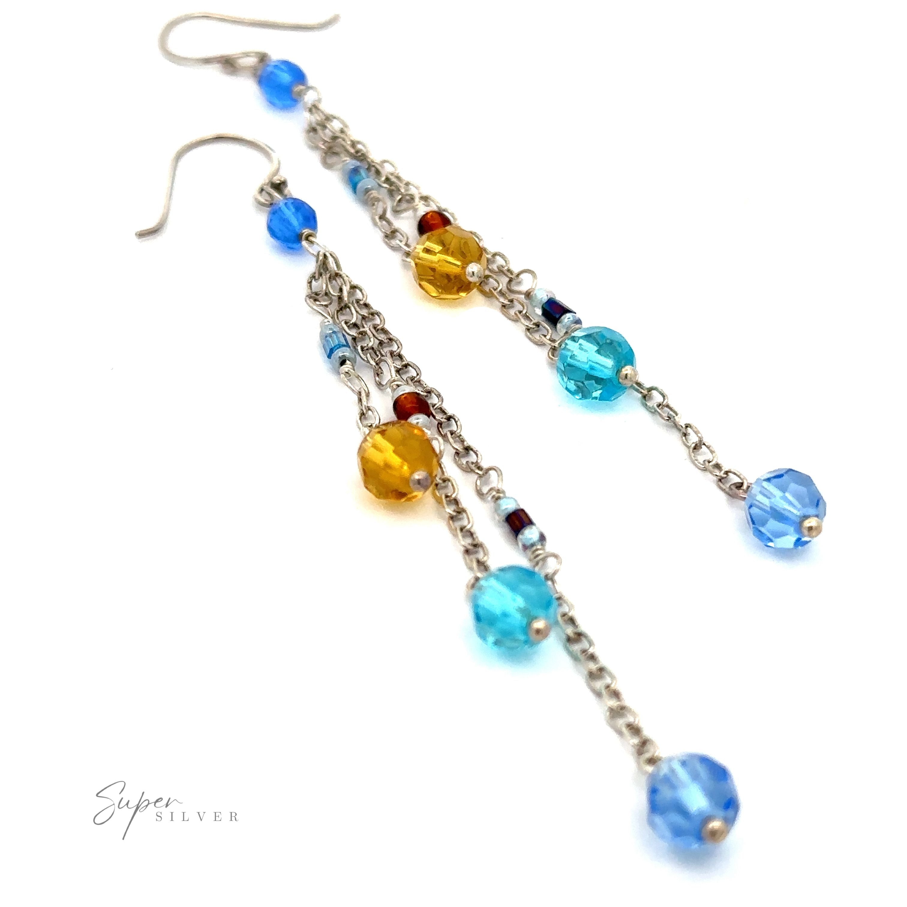 Two Multicolor Beaded Dangle Earrings adorned with multicolored beads in blue, yellow, and red hues. The earrings feature sleek chain details and multiple beads along the length.
