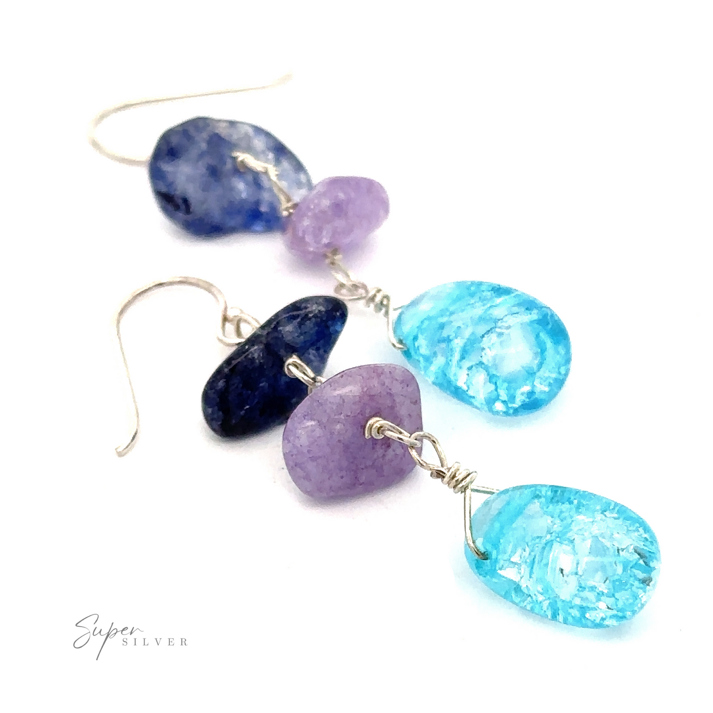 A pair of **Beaded Blue and Purple Earrings** featuring sterling silver hooks and three stones (bright blue beads, purple, and turquoise) on each. The stones are wire-wrapped with silver. The brand name "Super Silver" is visible in the corner.