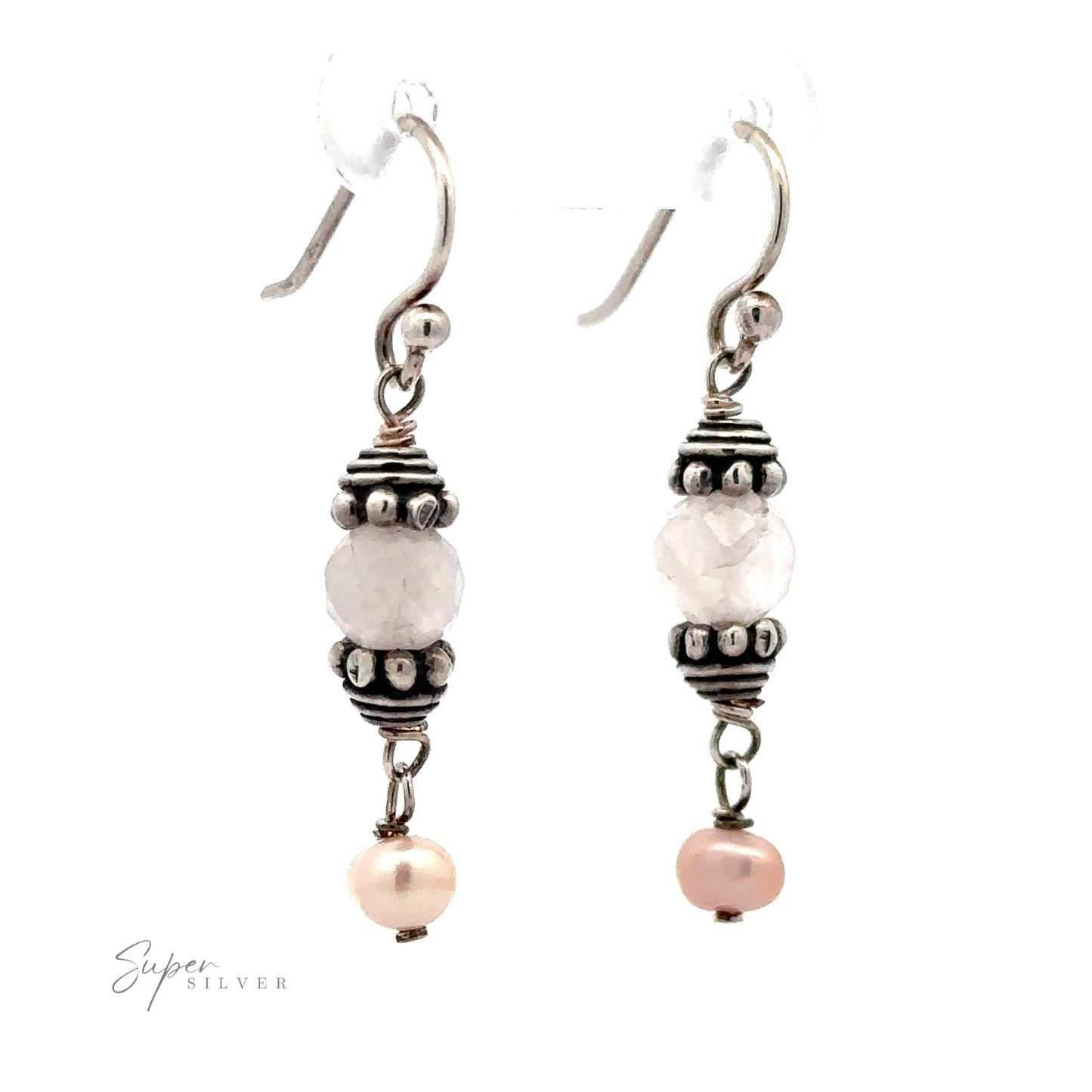 
                  
                    Certainly! Here is the sentence with the product name replaced:

A pair of Beaded Pink and Pearl Earrings featuring a central faceted bead flanked by decorative metal accents and a small pink pearl at the bottom.
                  
                