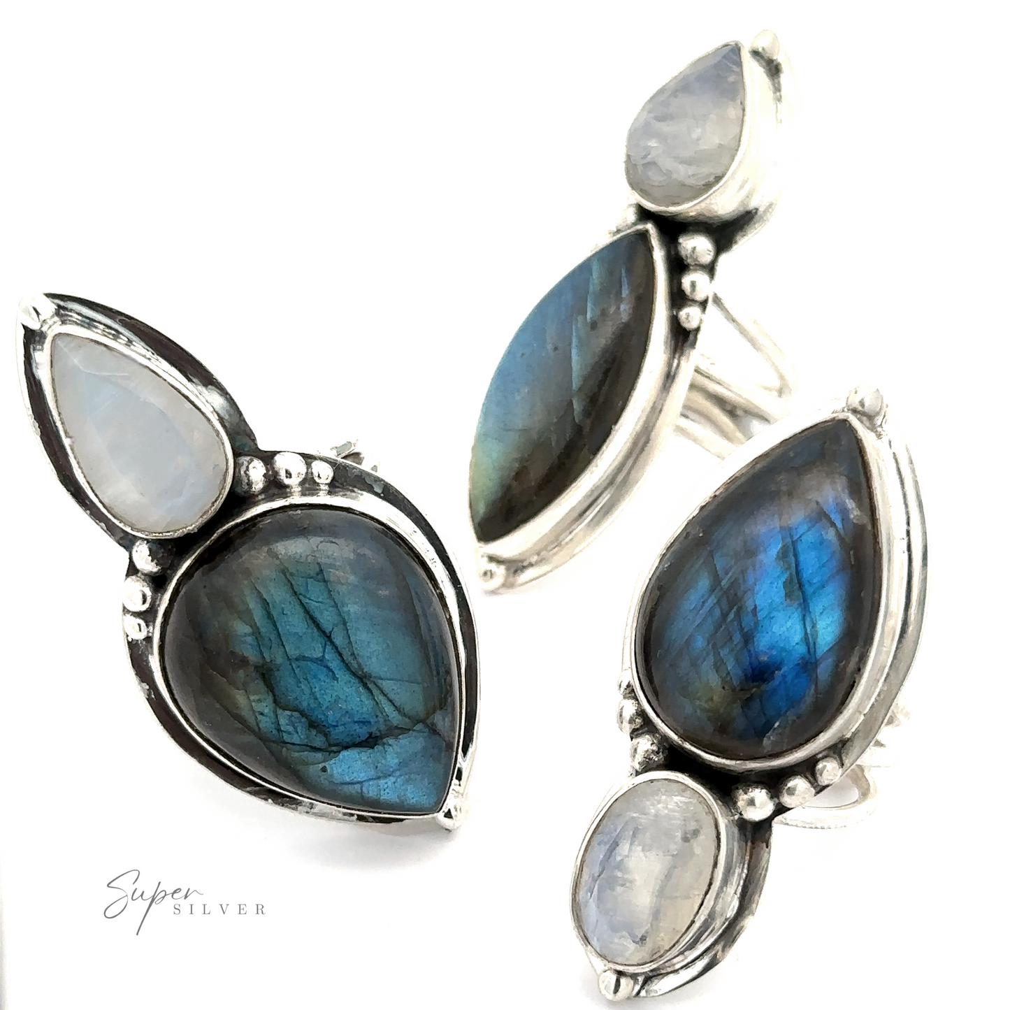 
                  
                    Three statement pieces of jewelry, including the Heavy Labradorite and Moonstone Ring, featuring labradorite and moonstone gemstones set in silver, displayed against a white background.
                  
                