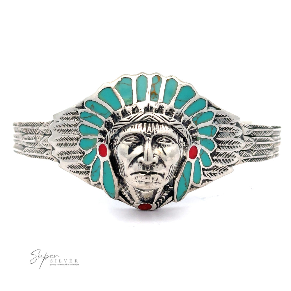 
                  
                    Silver bracelet with a turquoise and red enamel design featuring a detailed face and headdress motif, inspired by Native American heritage. The Chief Head Inlay Stone Cuff reads "Super Silver" on the bottom left.
                  
                
