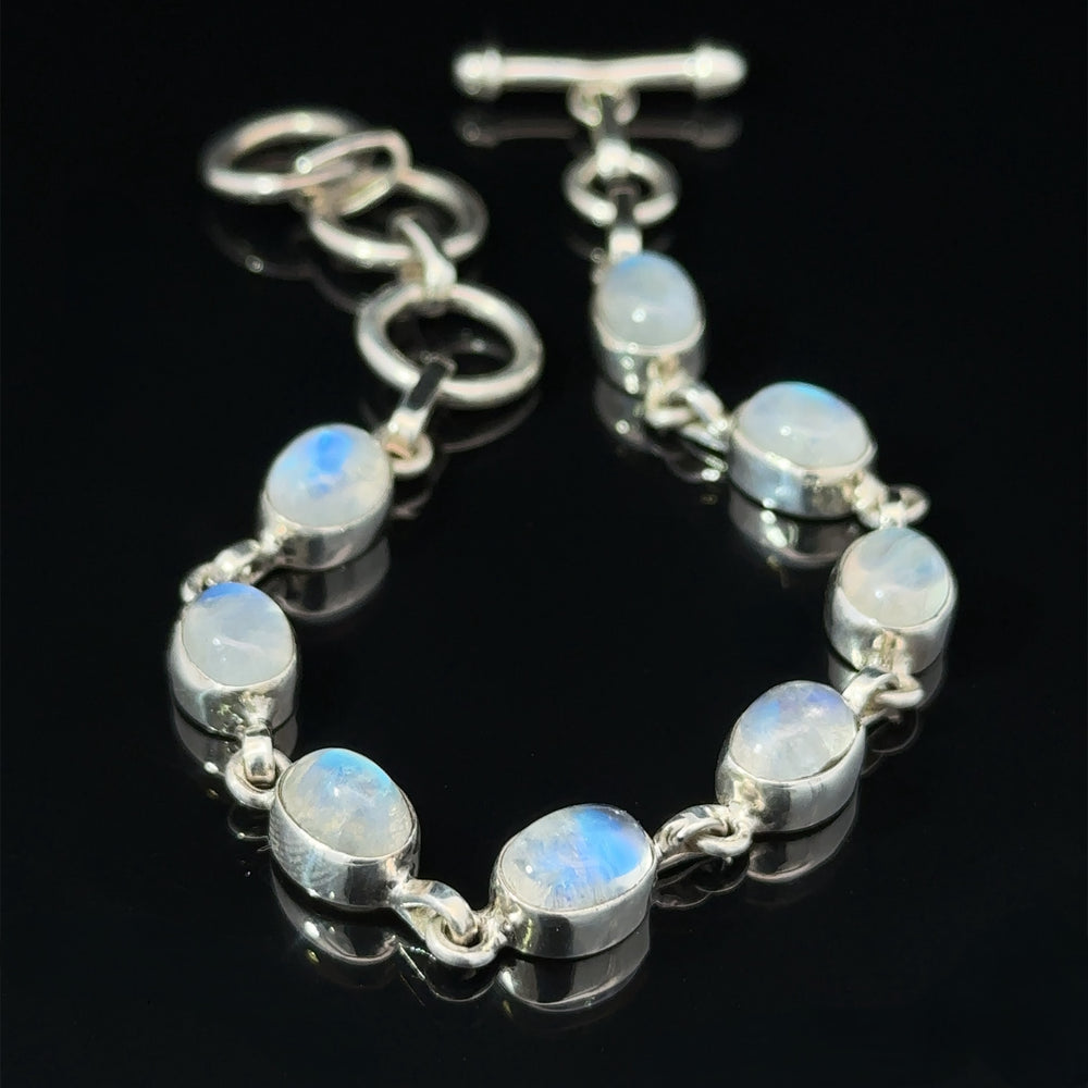 A Vibrant Oval Moonstone Bracelet featuring oval moonstone crystals set in individual links, with an adjustable clasp.