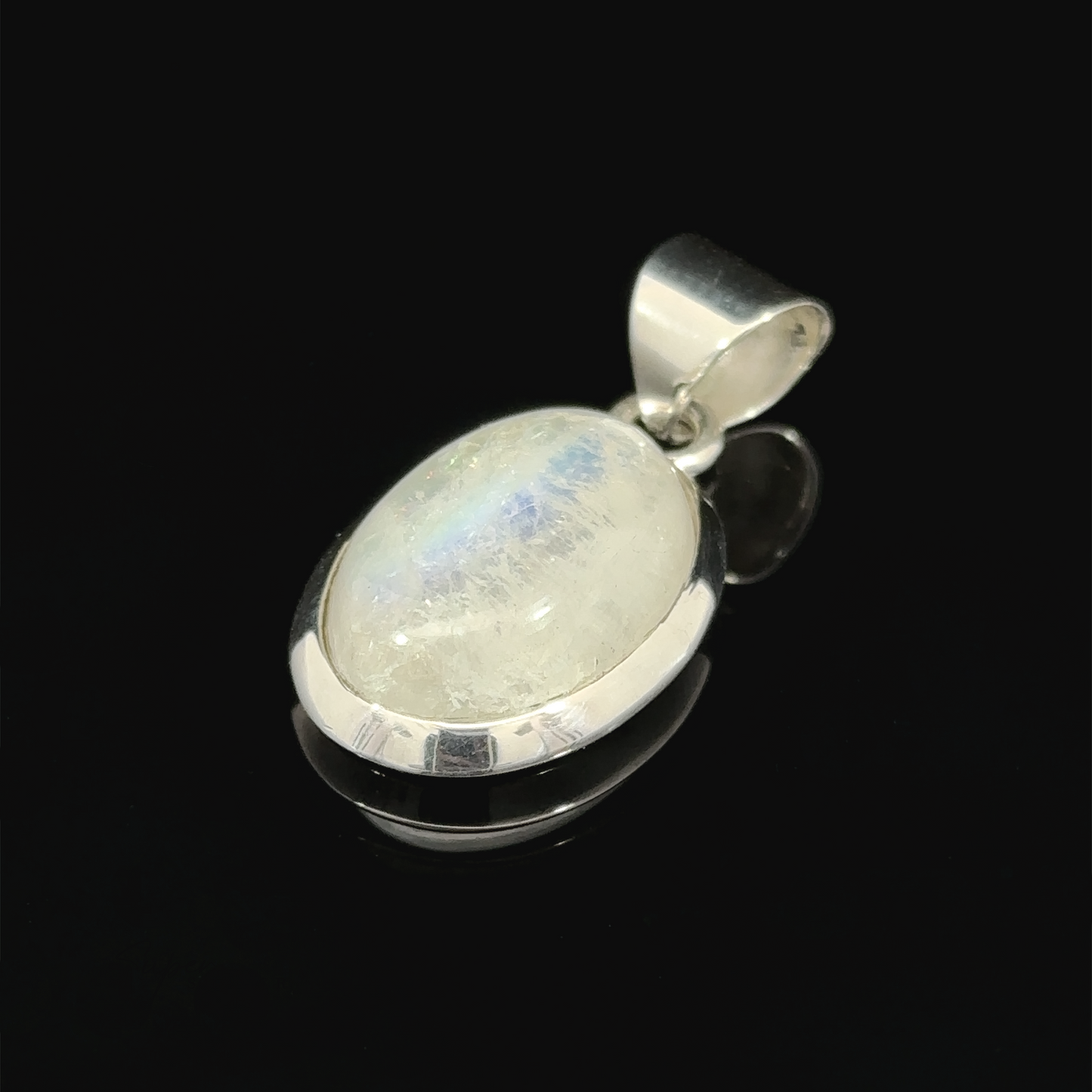 
                  
                    Simple moonstone oval pendant with a .925 Sterling Silver setting, displayed on a black background.
                  
                