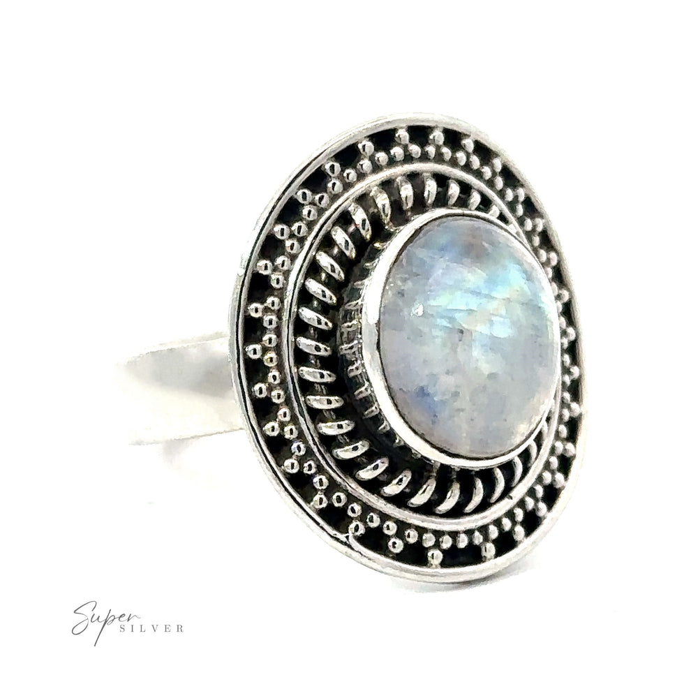 An oval moonstone ring with braided disc design.