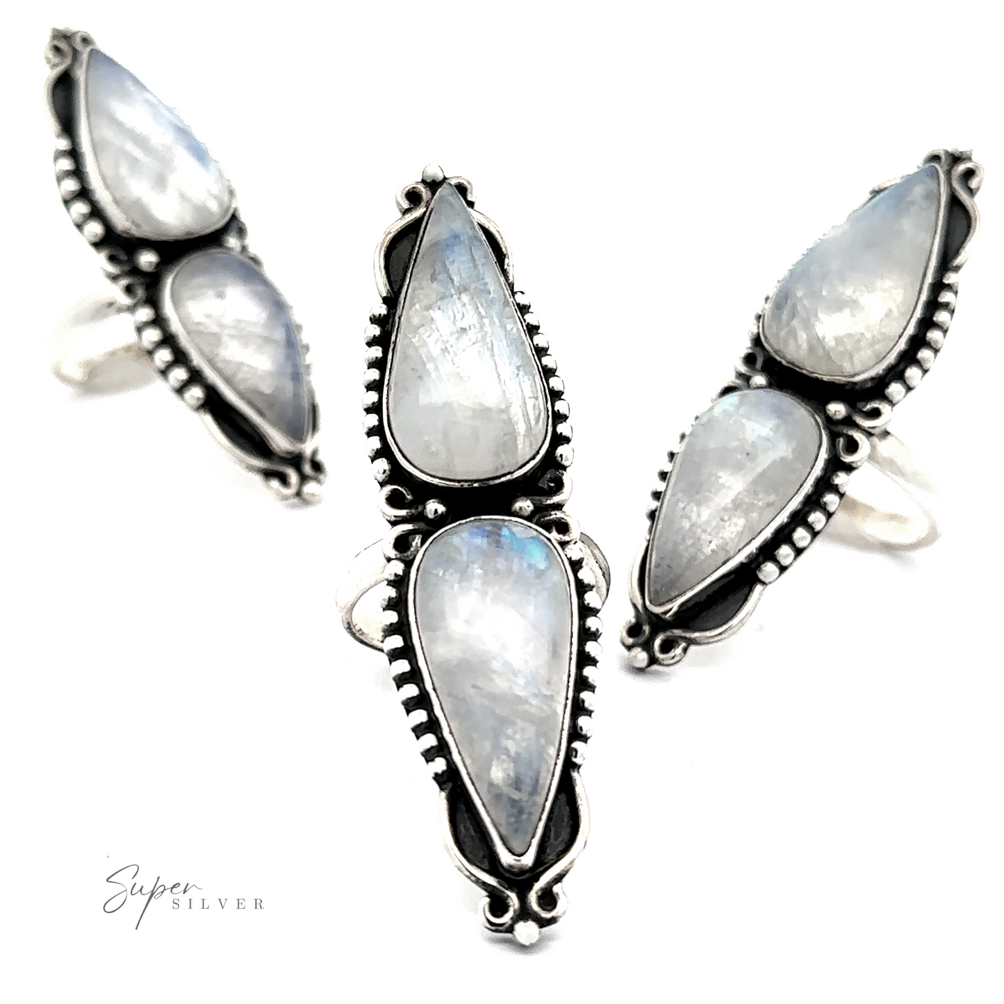 
                  
                    Three Long Double Teardrop Moonstone Rings arranged in close proximity on a white background, exuding the allure of statement jewelry.
                  
                