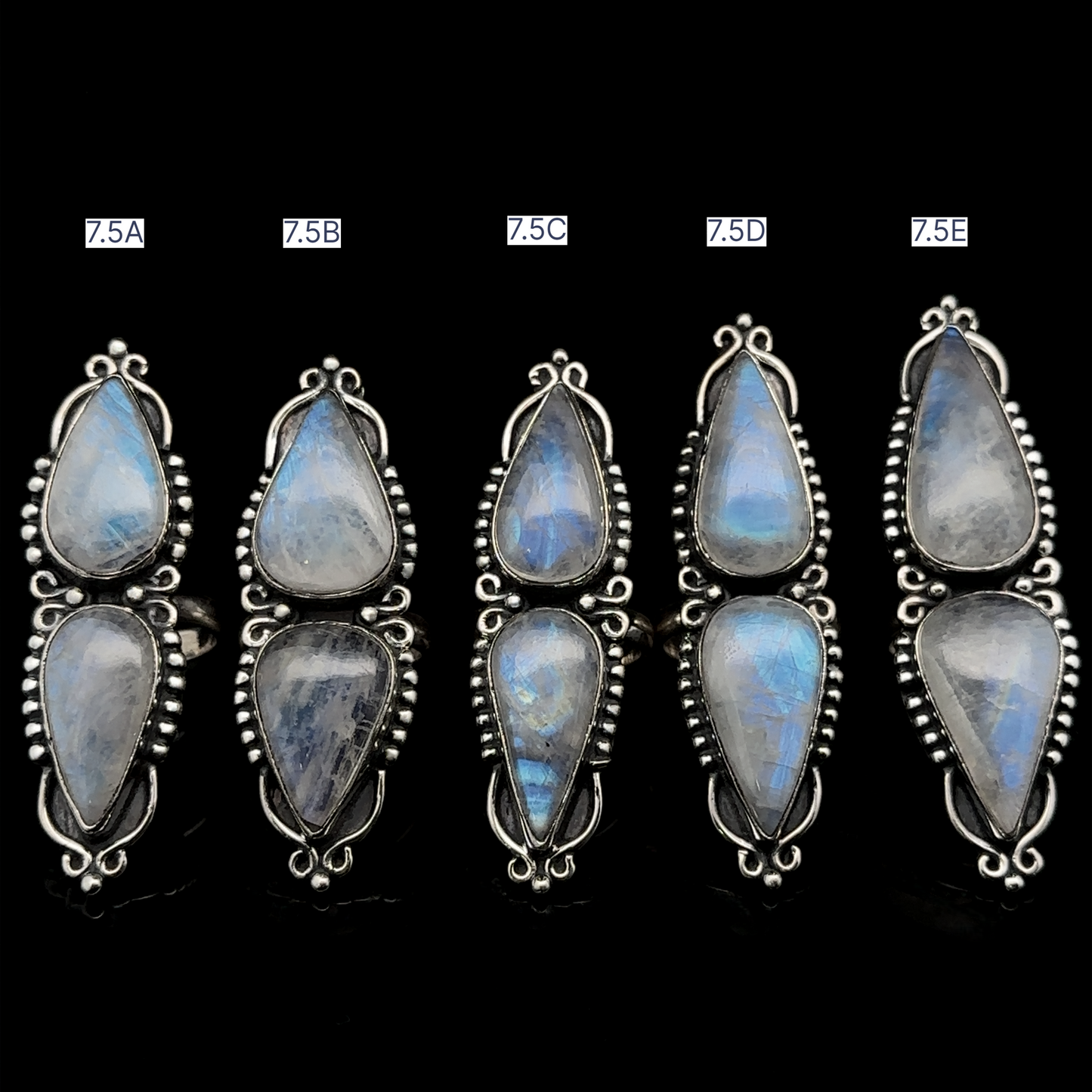 
                  
                    Five pairs of Long Double Teardrop Moonstone Rings, each set labeled as 7.5A, 7.5B, 7.5C, 7.5D, and 7.5E on a black background.

                  
                