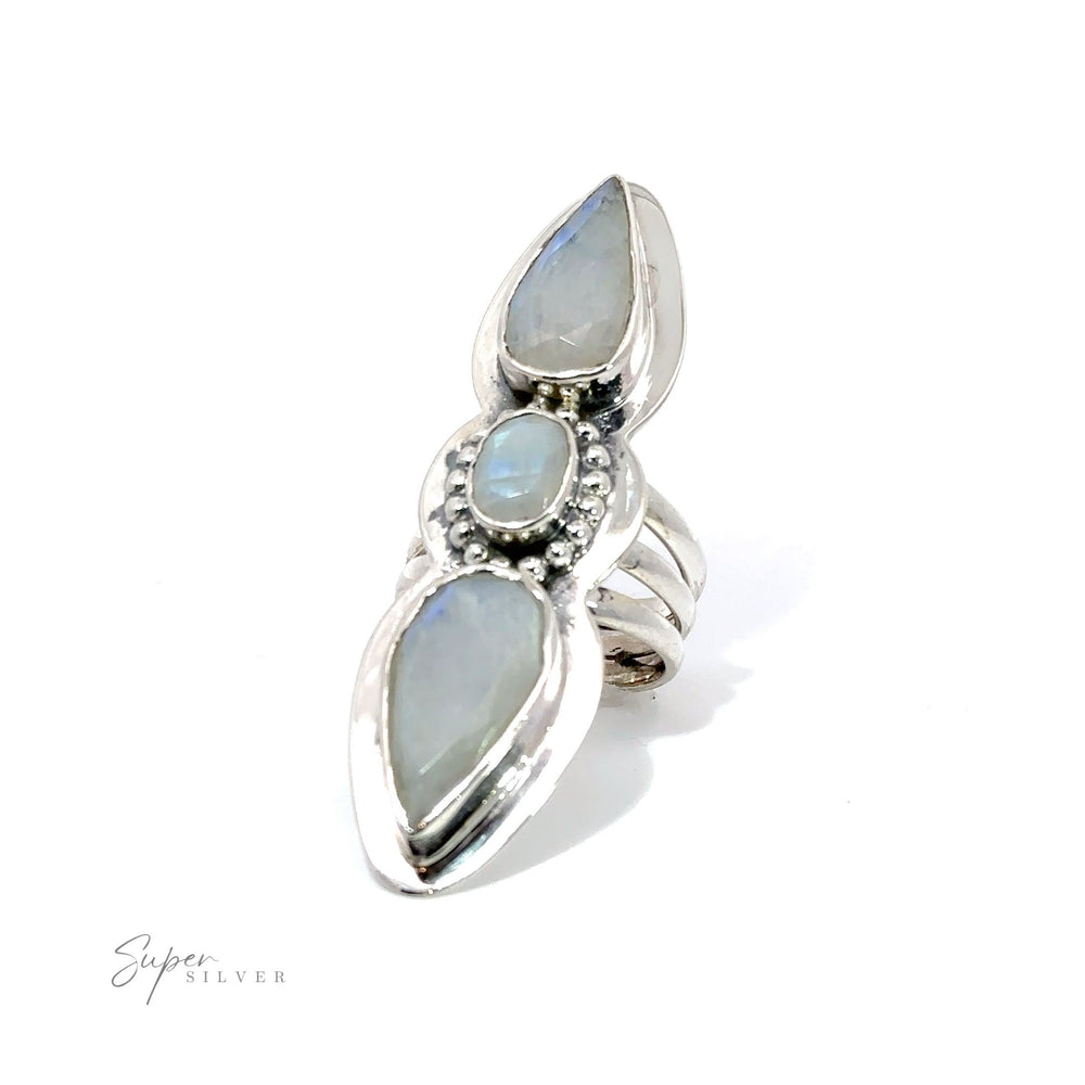 
                  
                    A Statement Faceted Moonstone Ring with a blue stone in the middle.
                  
                