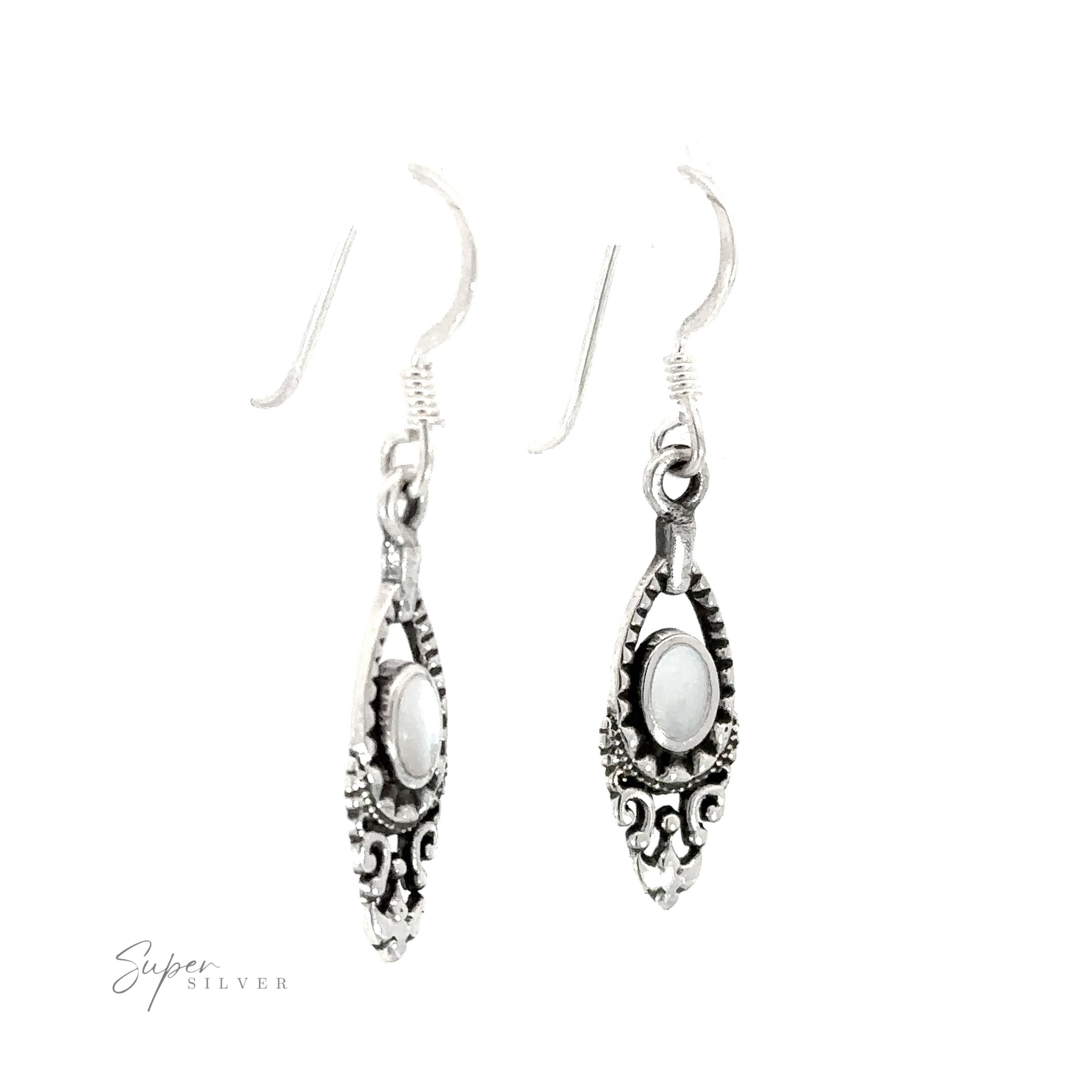 A small pair of Delicate Victorian Stone Earrings with a white stone.