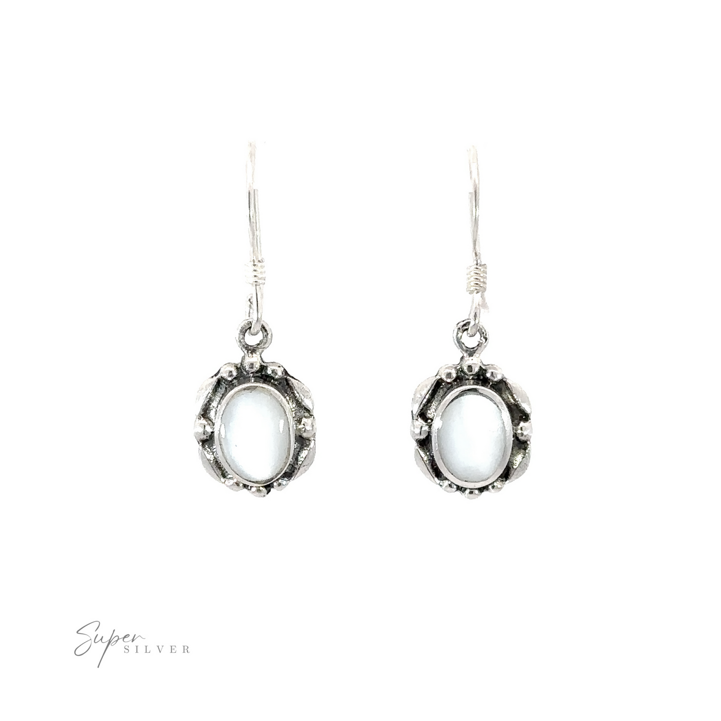 
                  
                    A pair of Oval Inlaid Stone Earrings with an inlaid white stone.
                  
                