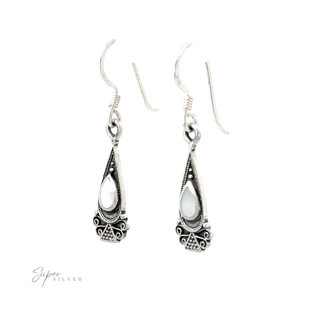 
                  
                    Bali Inspired Teardrop Shaped Earrings With Inlay Stones inlaid with silver.
                  
                
