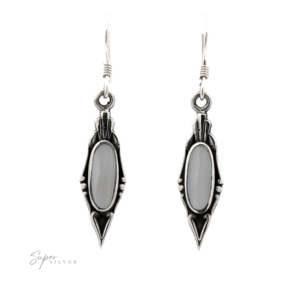 
                  
                    A pair of Elegant Inlaid Earrings with Oval Stone, these dangle earrings exude a vintage design.
                  
                