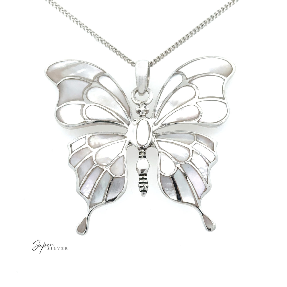 
                  
                    The Stunning Inlay Butterfly Pendant showcases mother-of-pearl inlays and turquoise accents in sterling silver, elegantly displayed on a chain against a white background.
                  
                